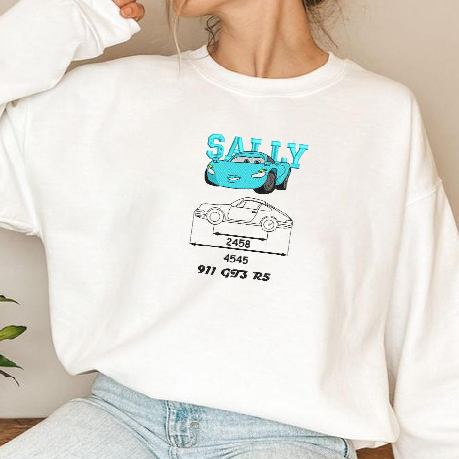 Model Wearing A White Embroidered Sweatshirt With Sally Couple Design.