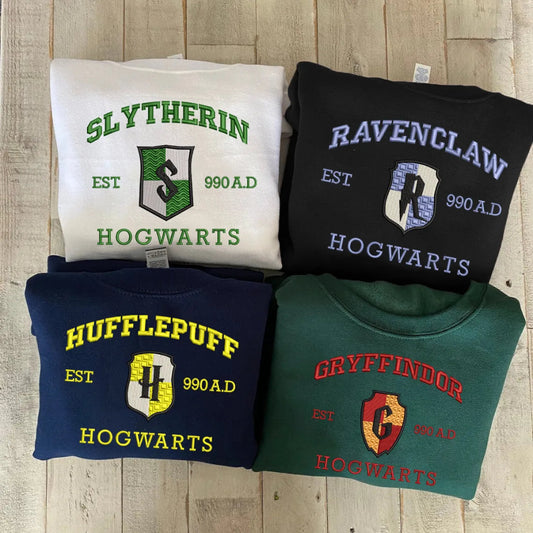 Folded Hogwarts House Sweatshirts: Slytherin, Ravenclaw, Hufflepuff, Gryffindor Displayed
