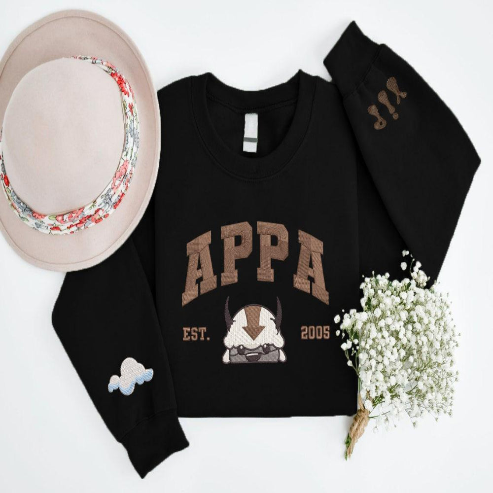 Black sweatshirt featuring embroidered Appa and sleeve details.