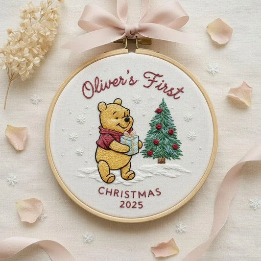 Welcome your little one’s magical holiday with our Personalized Classic Pooh Embroidered Ornament — a sweet keepsake made to celebrate your baby’s very first Christmas.
Each hoop features charming embroidery of Pooh with a festive Christmas tree, gently stitched on premium fabric to create a warm, nostalgic look.

Customize with your baby’s name and year to turn it into a timeless treasure. Whether it’s a gift for new parents, a nursery decoration, or a memory for the family tree, this ornament adds the per