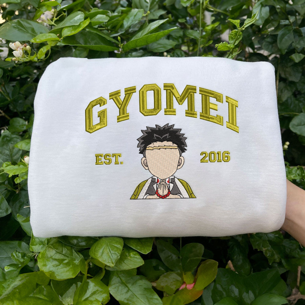 White Gyomei Stone Hashira sweatshirt held in foliage