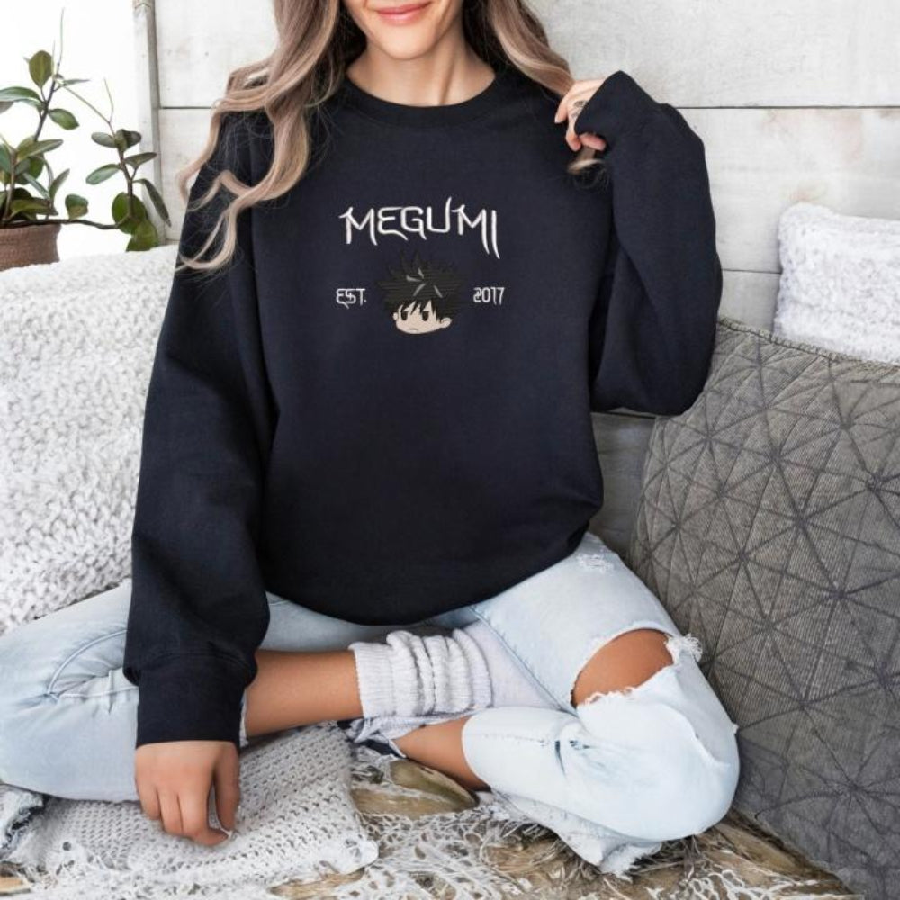 Black sweater, subtle Megumi chest embroidery, clean anime stitched details
