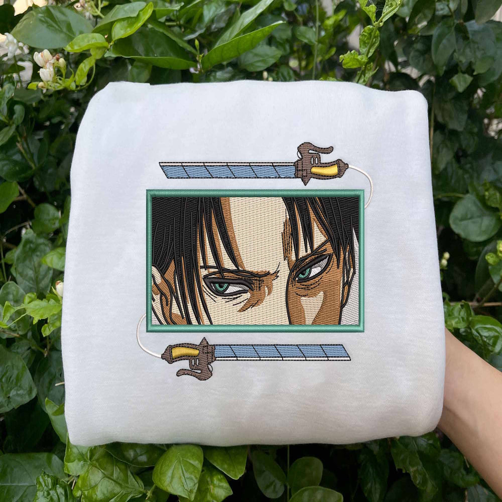 White Levi Ackerman embroidered sweatshirt on green leaves background