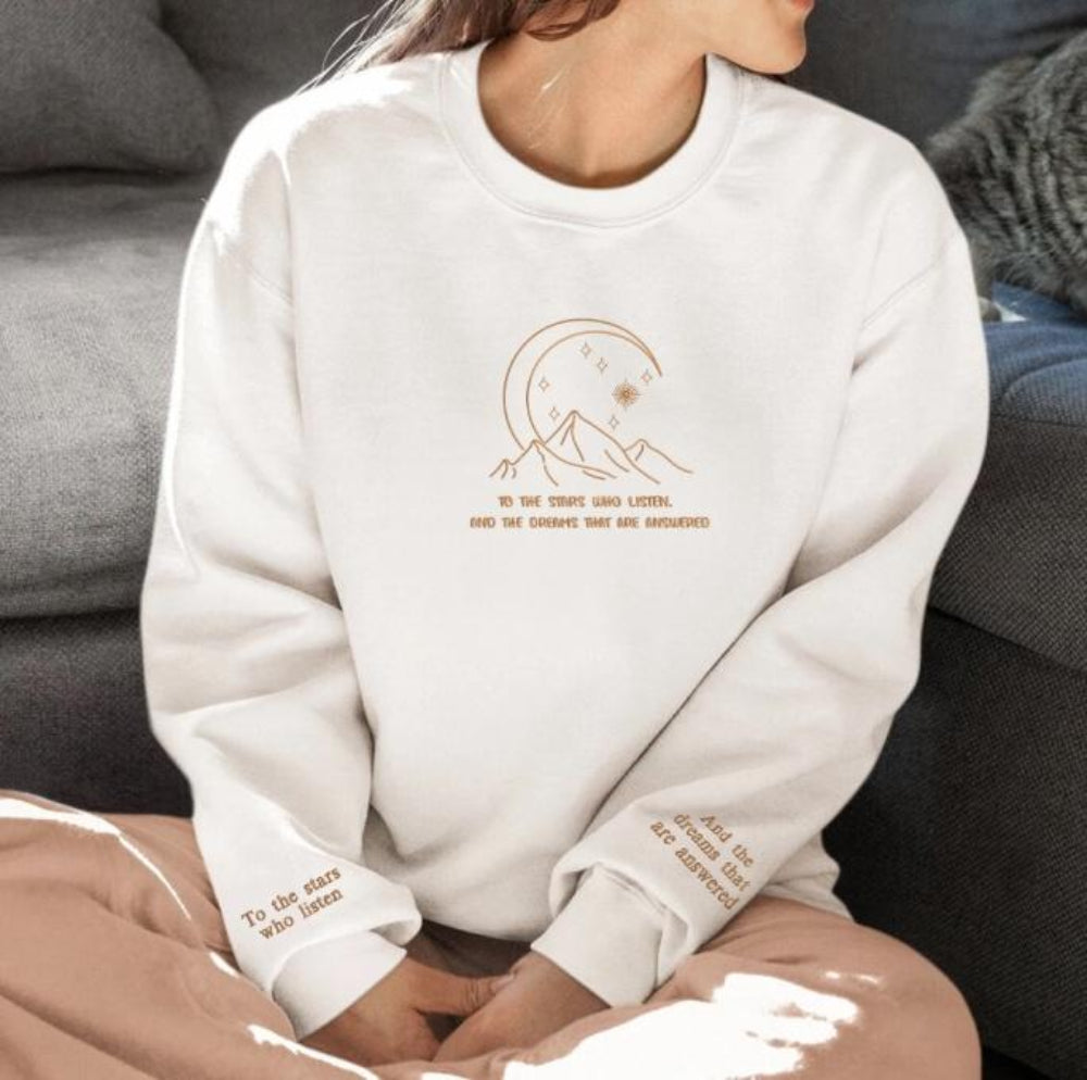 White To The Stars Who Listen crewneck, cozy model pose