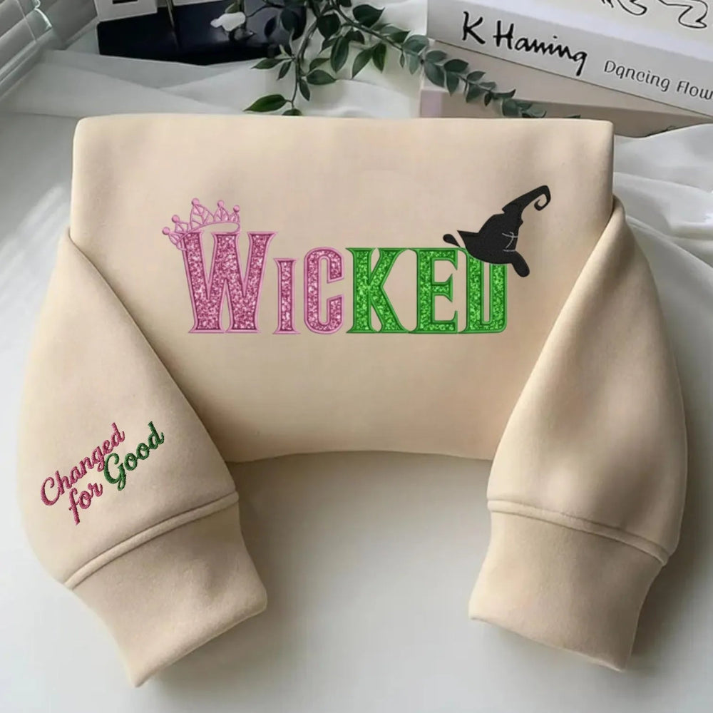 Sand "Wicked" Embroidered Sweatshirt With Sleeve Text Displayed Flat.