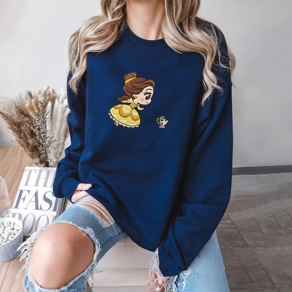 Model In Navy Sweatshirt With Embroidered Chibi Belle And Chip