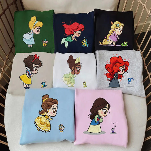 Assorted Embroidered Princess Sweatshirt Displayed On Table