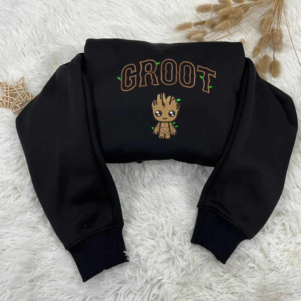 Black Cropped Hoodie Folded Displaying Chibi Groot With Leaf Accents