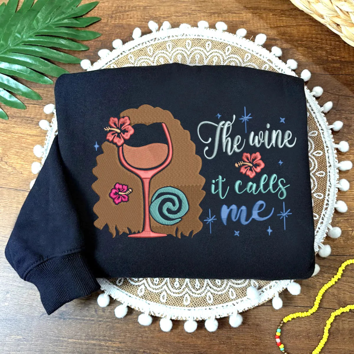 Navy Sweatshirt Displaying The Wine It Calls Me With Hibiscus Flowers.