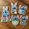 Five Cute Stitch Easter Bunny Patches Numbered On Wooden Table.