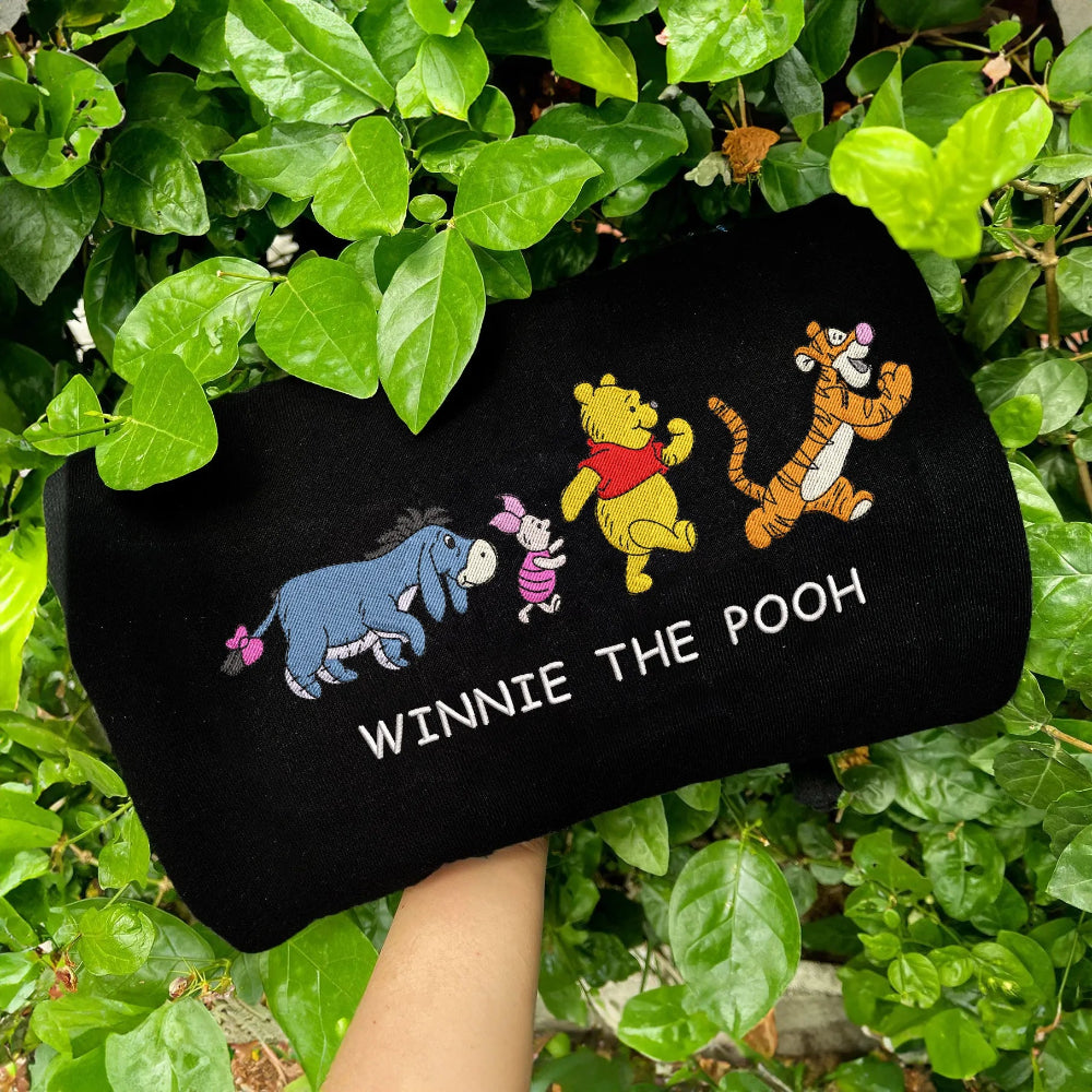 Black Winnie Pooh Characters Embroidered Sweatshirt Folded, Vibrant Parade Graphic