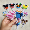 Hand Holding Pink Minnie And Blue Stitch Balloon Embroidered Patches.