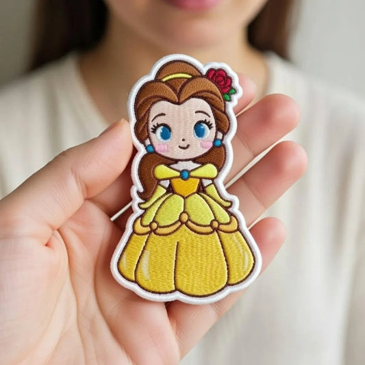 Hand Holding Chibi Belle Patch From Beauty And The Beast
