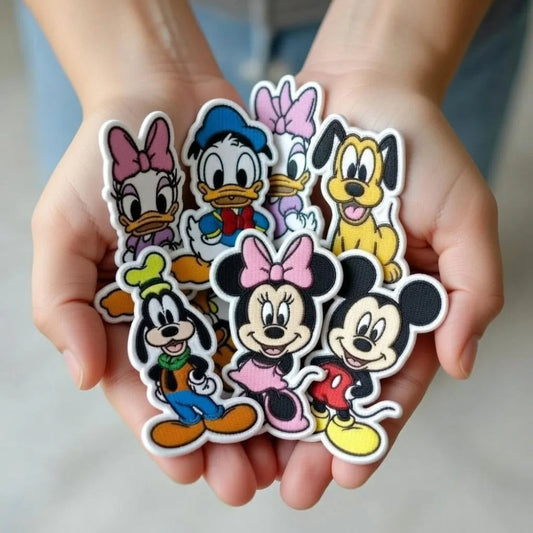 Hands Holding Collection Of Cute Disney Character