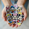 Hands Holding Collection Of Cute Disney Character