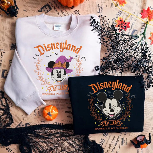 White And Black Mickey Mouse Witch Halloween Sweatshirts Displayed