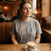 T-Shirt Worn In Cafe Showing Vintage Floral Lightsaber Patch Design