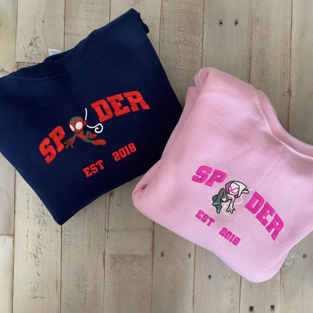 Navy & Pink Spider 2018 Duo Sweatshirts On Plank Floor