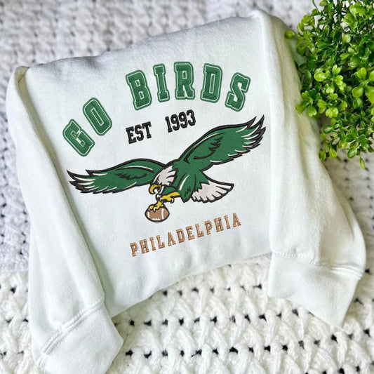 White Sweatshirt With Go Birds Eagles Embroidered Folded On Crochet