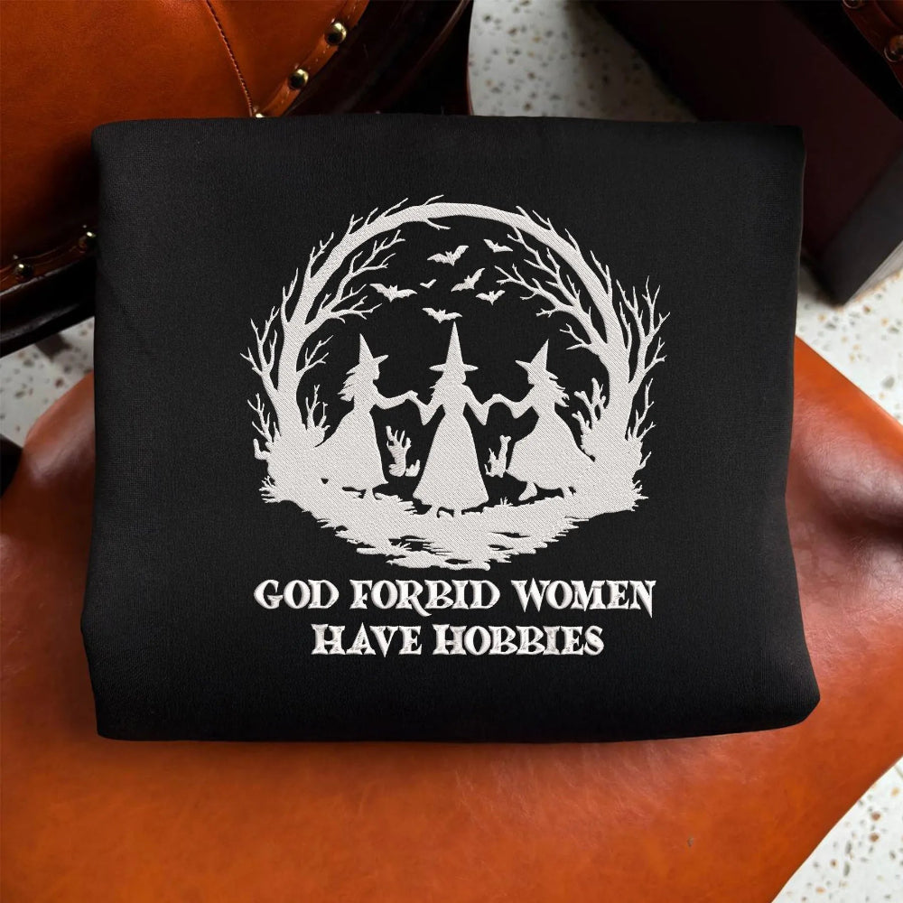 Black Sweatshirt Folded With White Witch Circle And Hobby Quote