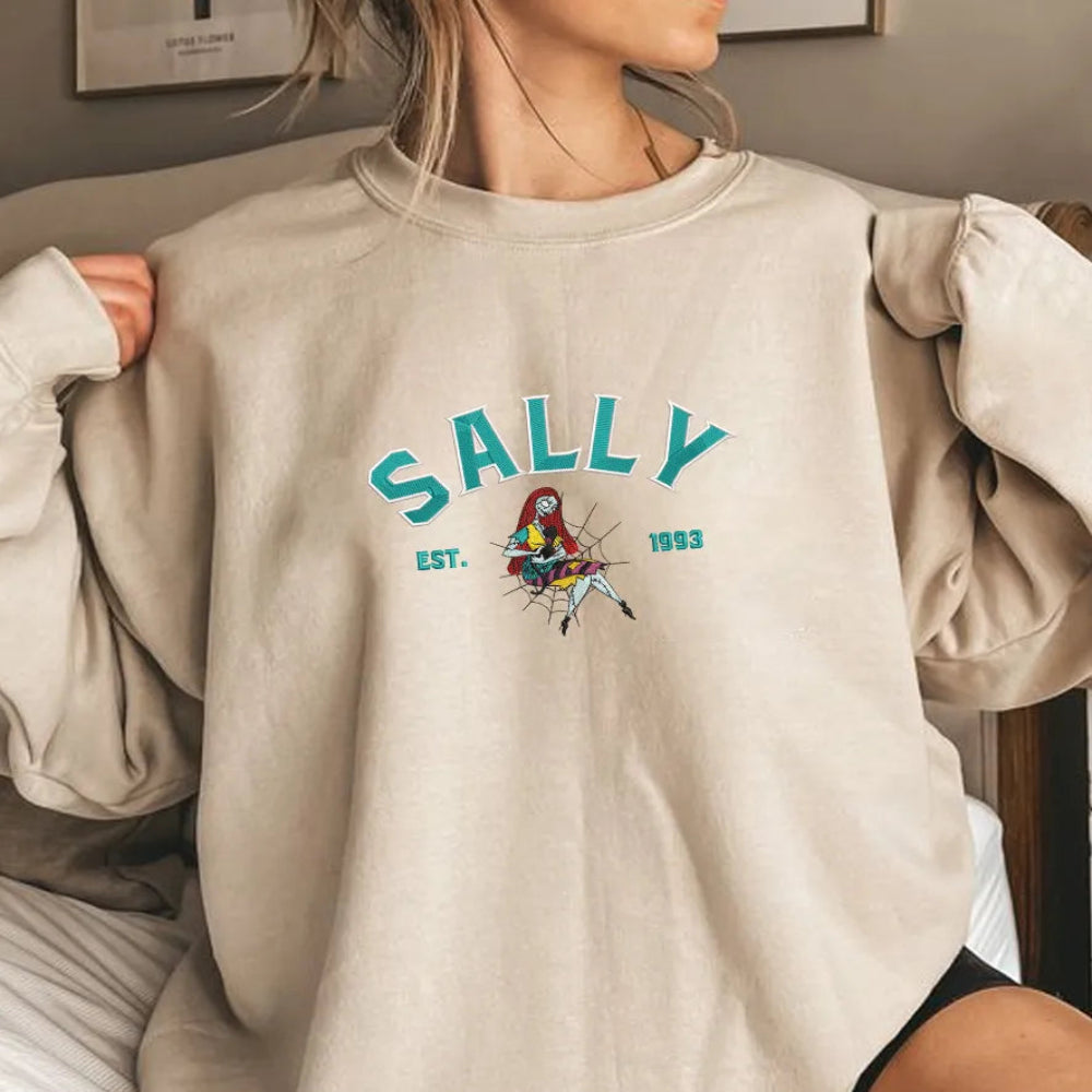 Woman Wearing Sally Embroidered Sweatshirt With Teal Text, Spider Web