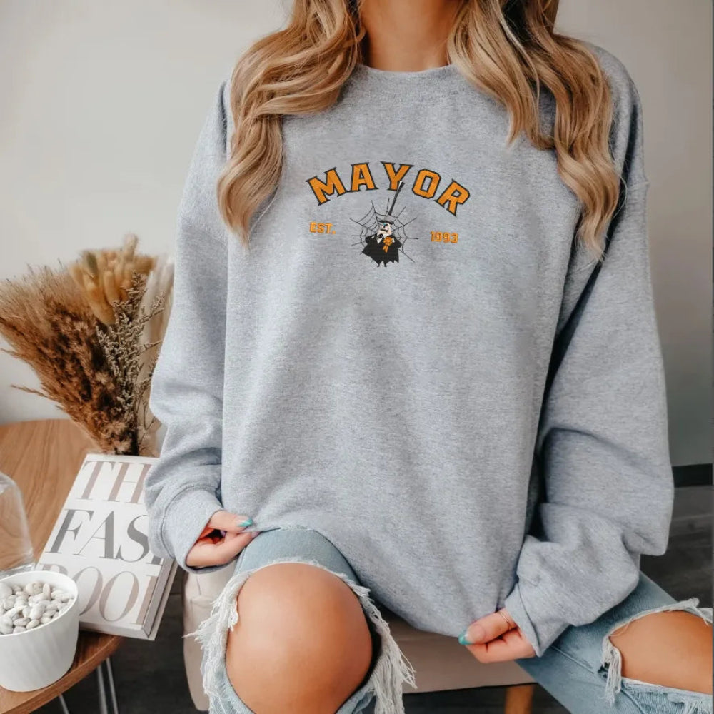 Woman In Mayor Embroidered Sweatshirt With Orange Text, Spider Web