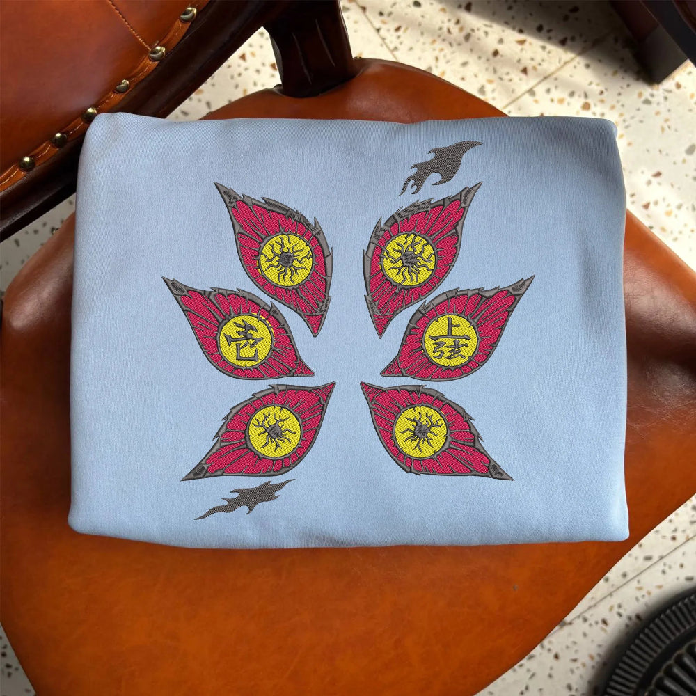 Light Blue Folded Sweatshirt Illustrating Stylized Six Eyes Demon Crest