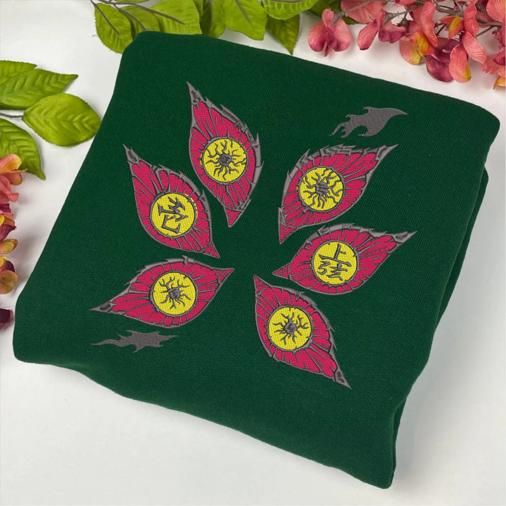 Folded Hoodie Displaying Embroidered Kokushibo Eyes And Flame Accents