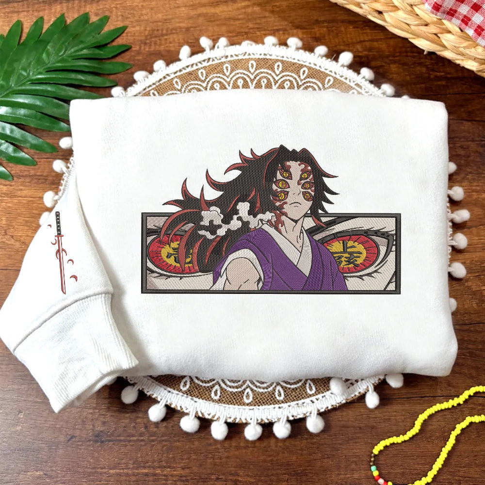 White Sweatshirt With Kokushibo Six Eyes Embroidered Folded On Table