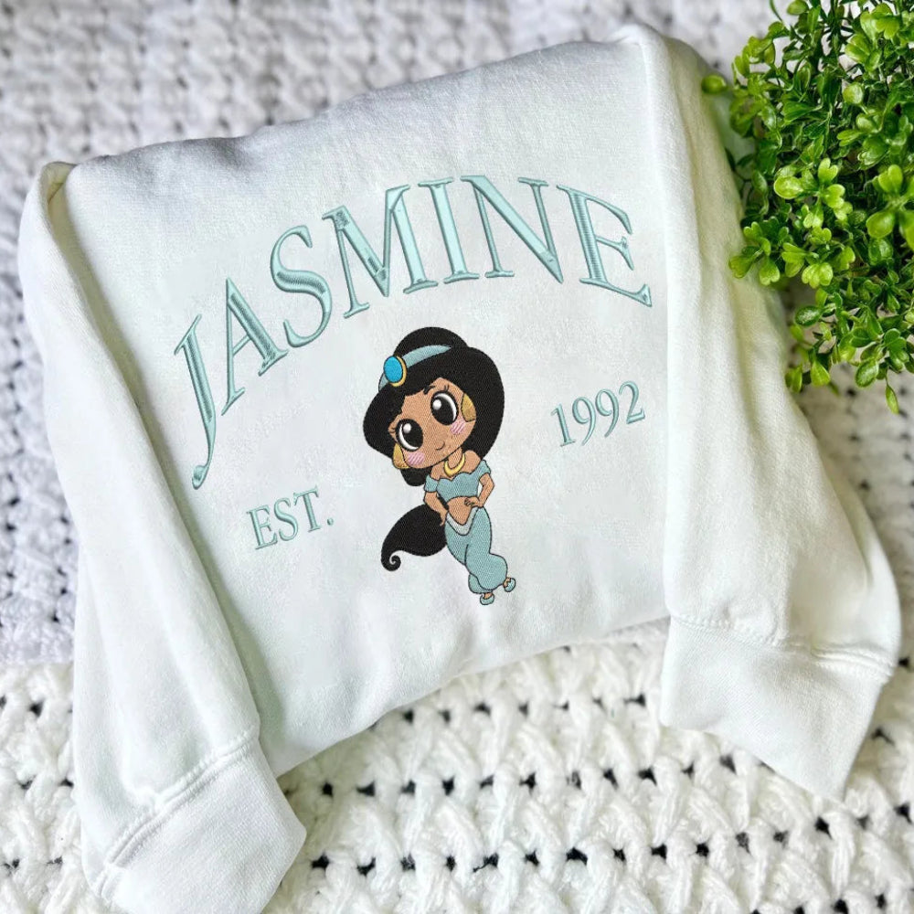 White Jasmine Embroidered Sweatshirt With Teal Chibi Character And Text