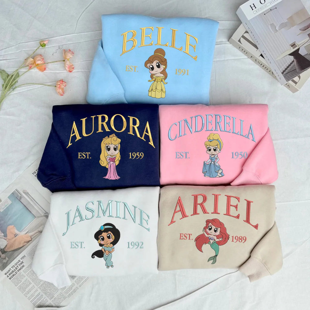Sweatshirts Displayed With Embroidered Belle, Aurora, Cinderella, Jasmine, Ariel Designs