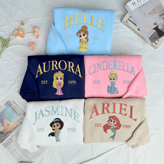 Sweatshirts Displayed With Embroidered Belle, Aurora, Cinderella, Jasmine, Ariel Designs