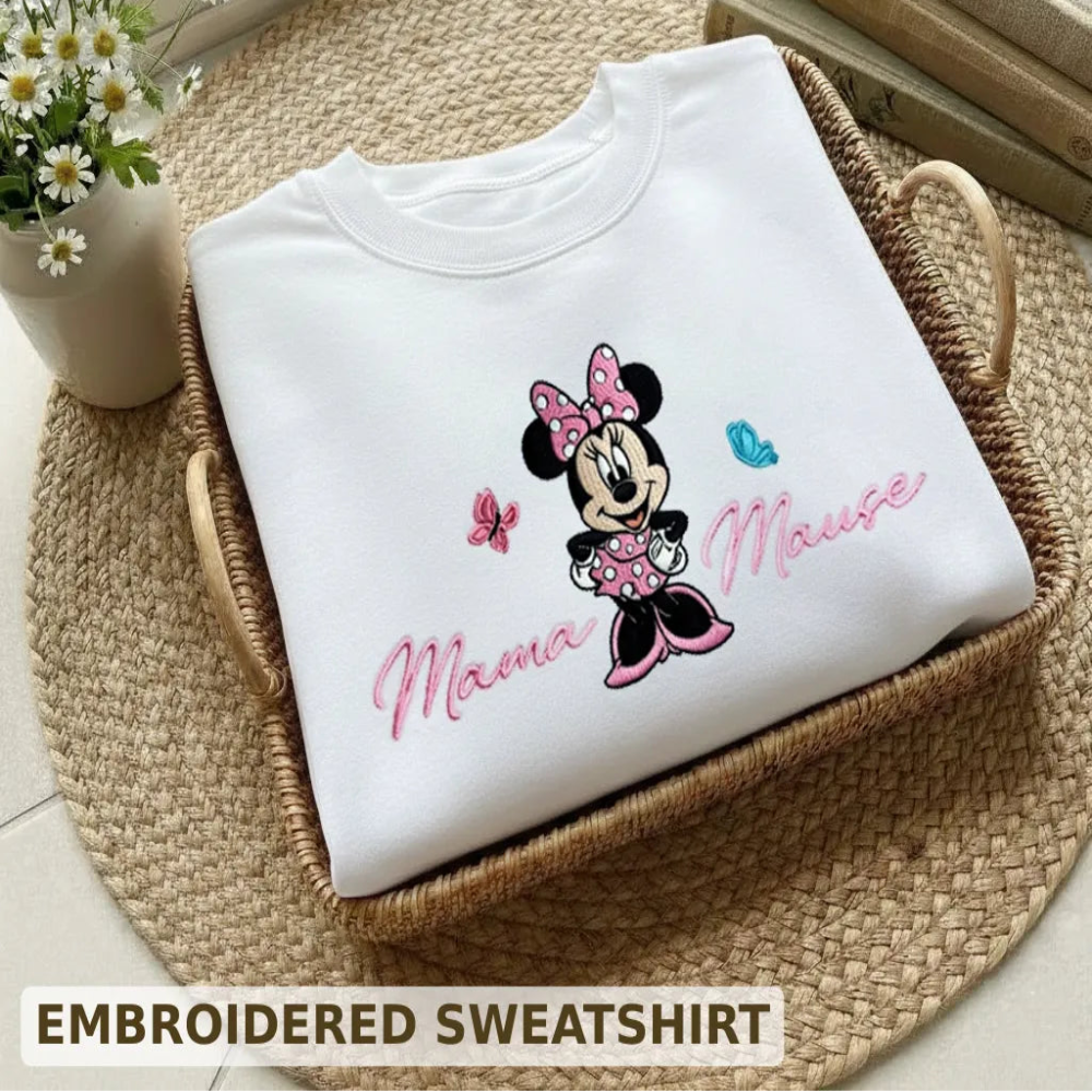 White Sweatshirt Minnie Mouse Mama Embroidered With Butterflies Close-Up Folded.