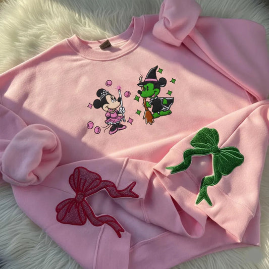 Pink Minnie Witch Embroidered Crewneck Folded, Green Sparkle Bow Accents