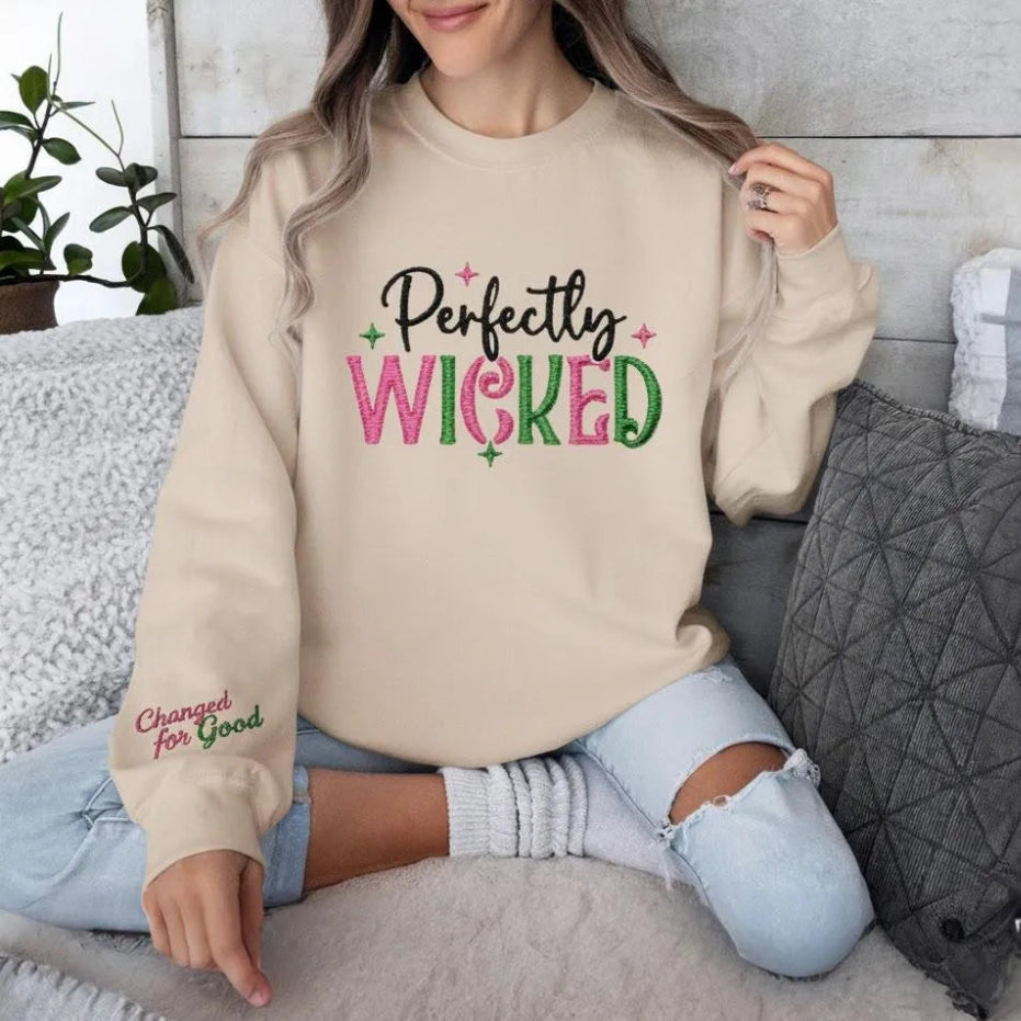 Sand "Perfectly Wicked" Embroidered Sweatshirt Worn Casually Indoors.