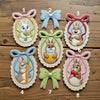 Numbered Peter Rabbit Patches One To Eight On Wooden Background 