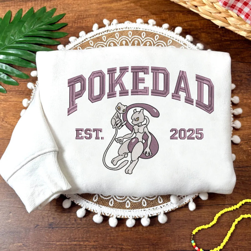 White Sweatshirt With Purple Embroidered Pokedad, Mewtwo Holding Mew Design