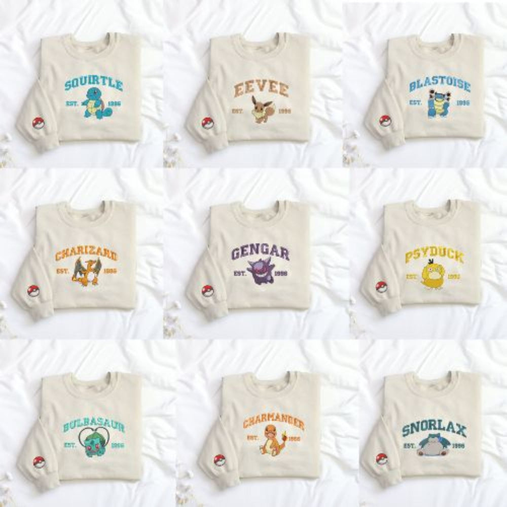Nine Embroidered Pokemon Character Sweatshirts On White Background.
