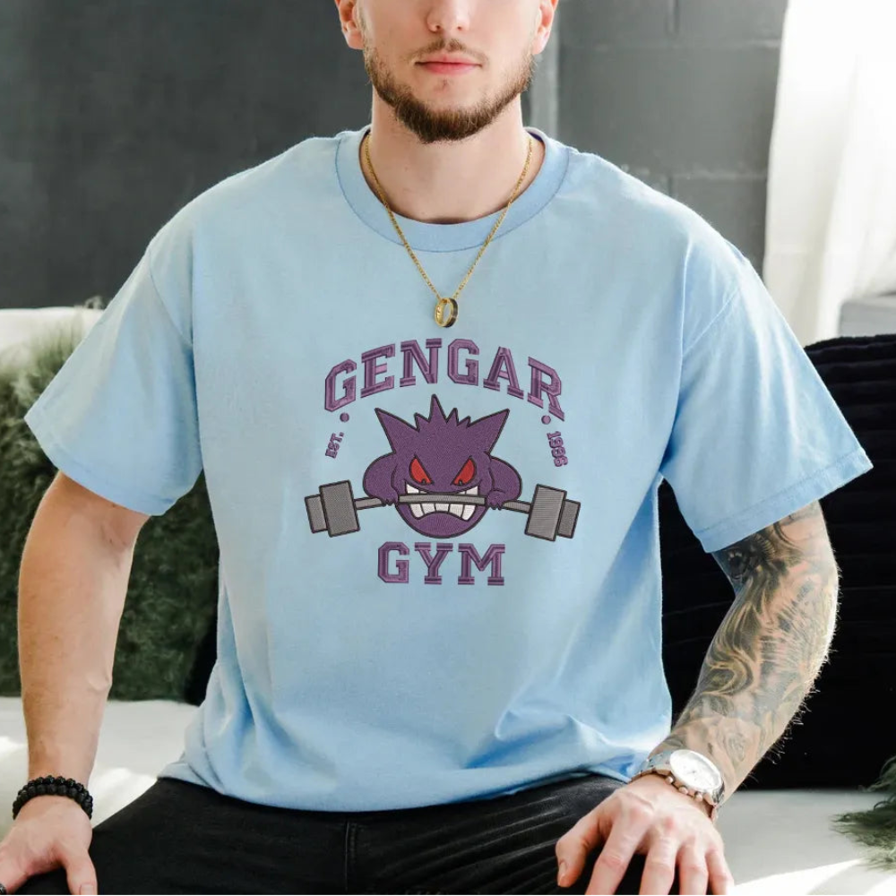 Grinning Gengar Gym Embroidery Design On Light Blue T-shirt.