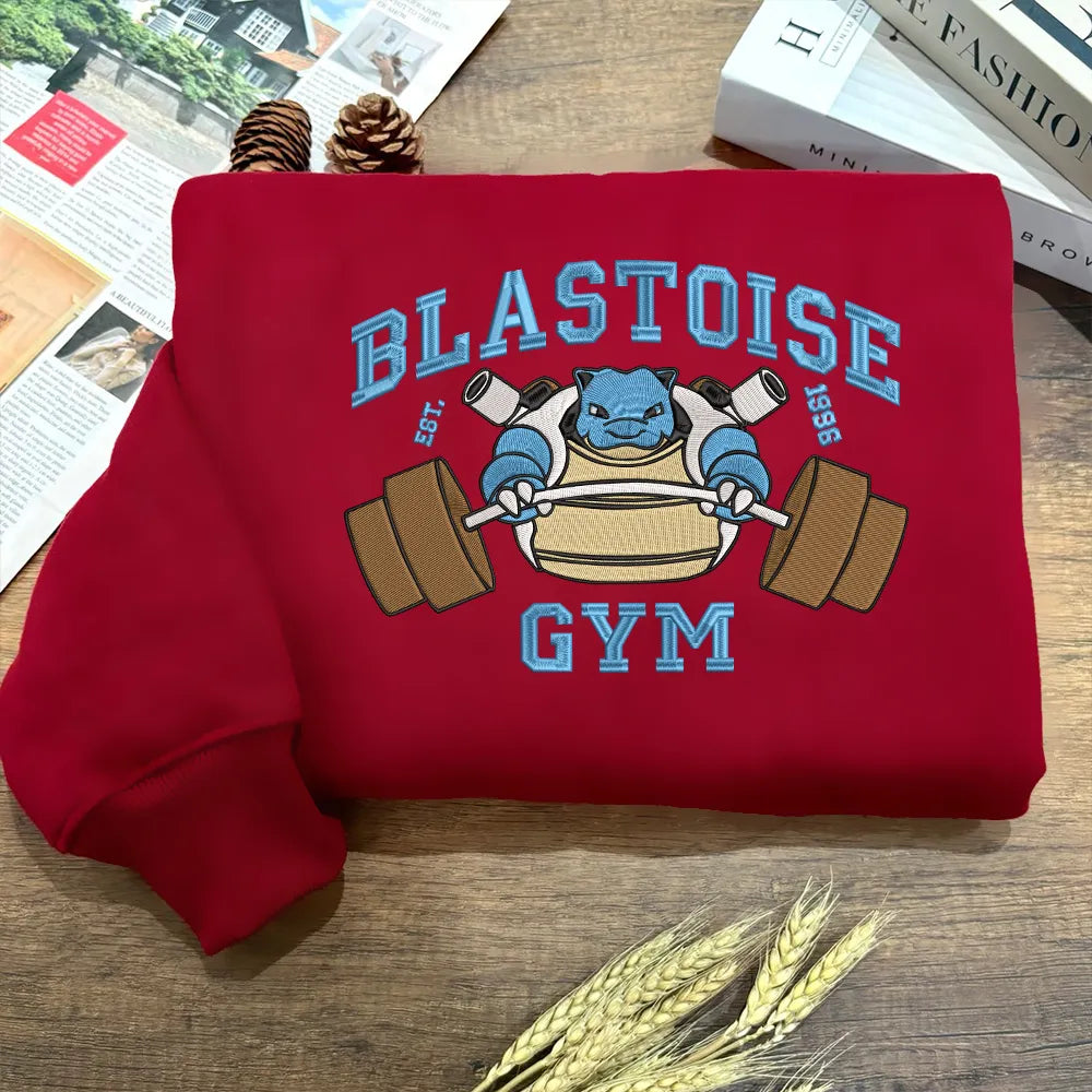 Blastoise Gym Weightlifting Design On Fiery Embroidered Sweatshirt.