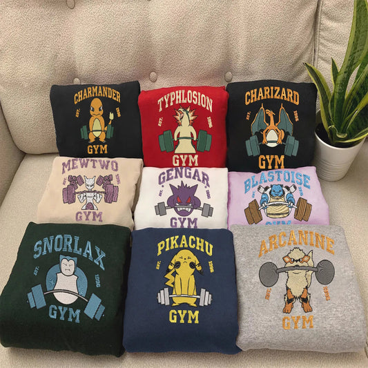 Nine Different Pokemon Gym Weightlifting Embroidery Designs On Folded Apparel.