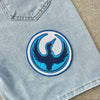 Blue Jeans Pocket Displaying Bold Rebel Loon Circular Embroidered Patch