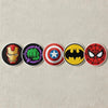 Horizontal Row Of Five Superhero Logo Patches On Fabric Background