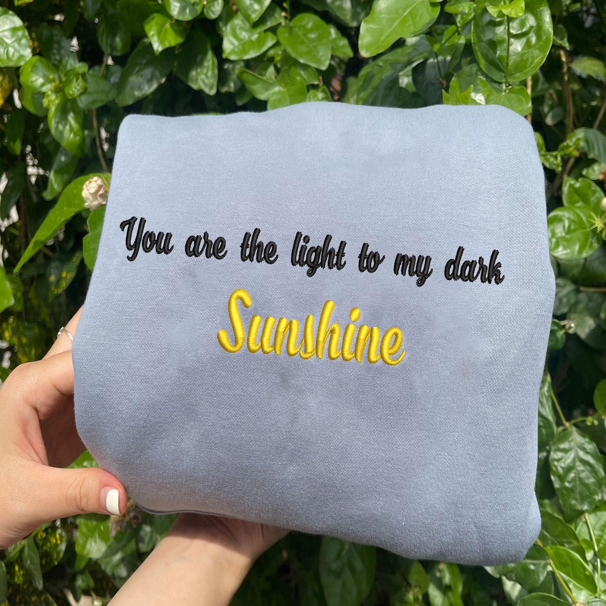 Light Blue Sunshine Embroidered Sweatshirt Outside.