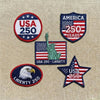 Close-Up Display Of USA Liberty 250 Patches Featuring Eagle, Stars

