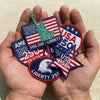 Hands Holding Assorted USA 250 Liberty Embroidered Patches 
