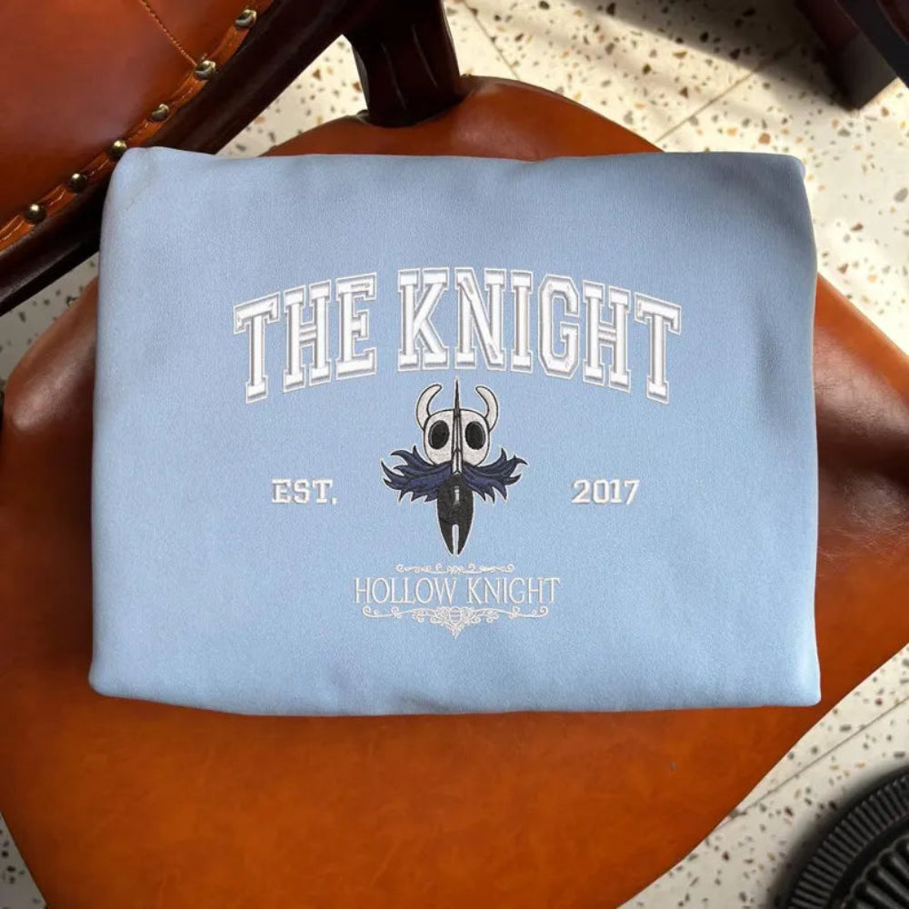 The Knight Embroidered Crewneck Folded, Classic Bug Knight Graphic
