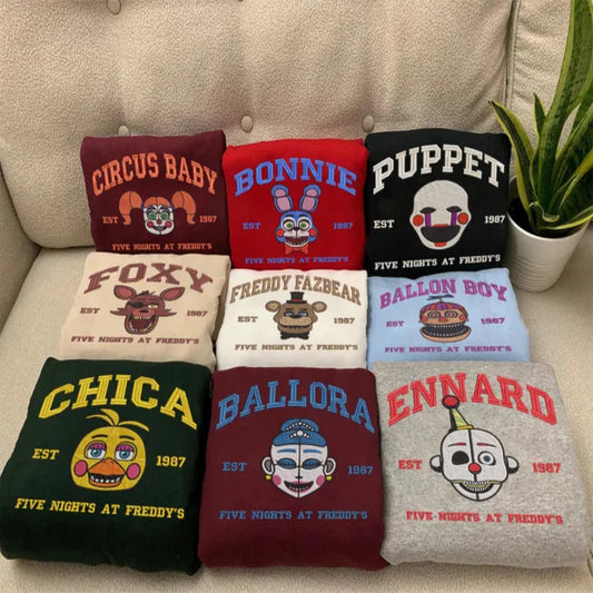 Assorted FNAF Character Folded Sweatshirts On Couch, Balloon Boy To Ennard
