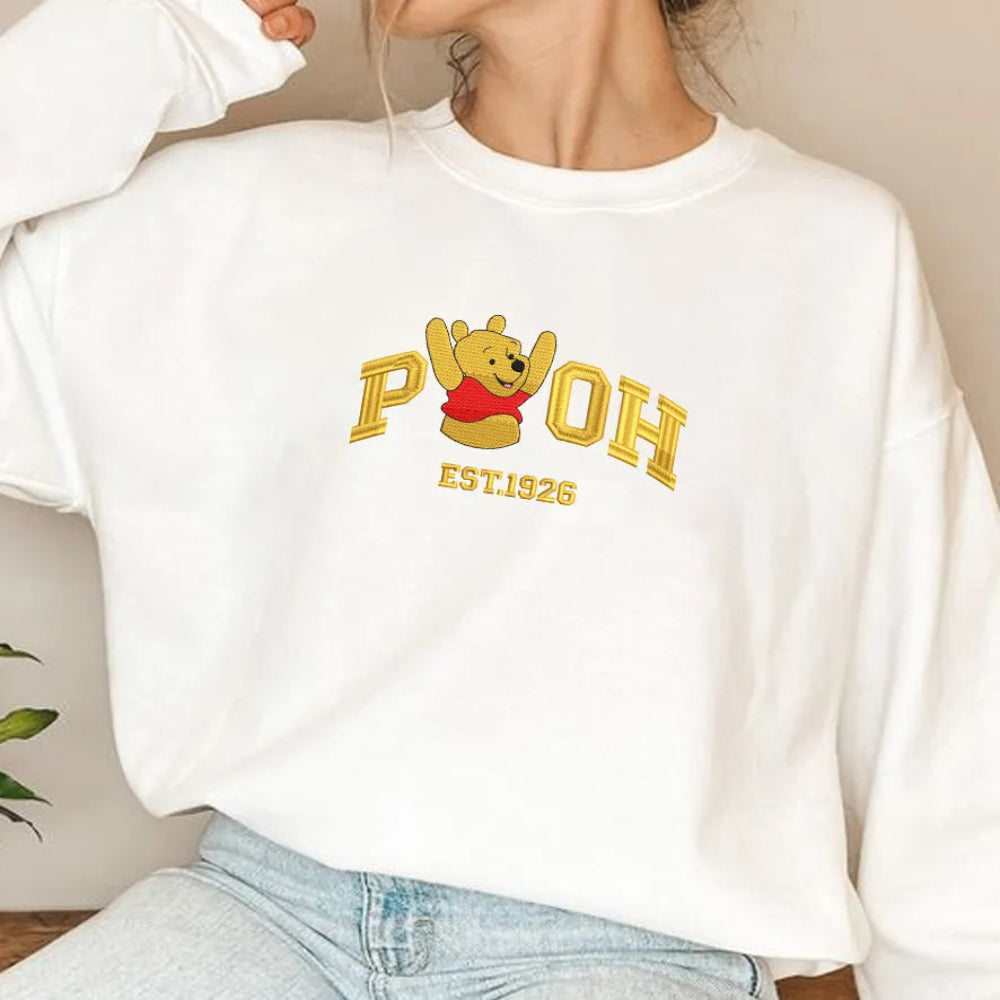 Woman Wearing White Pooh Embroidered Sweatshirt In Casual Pose