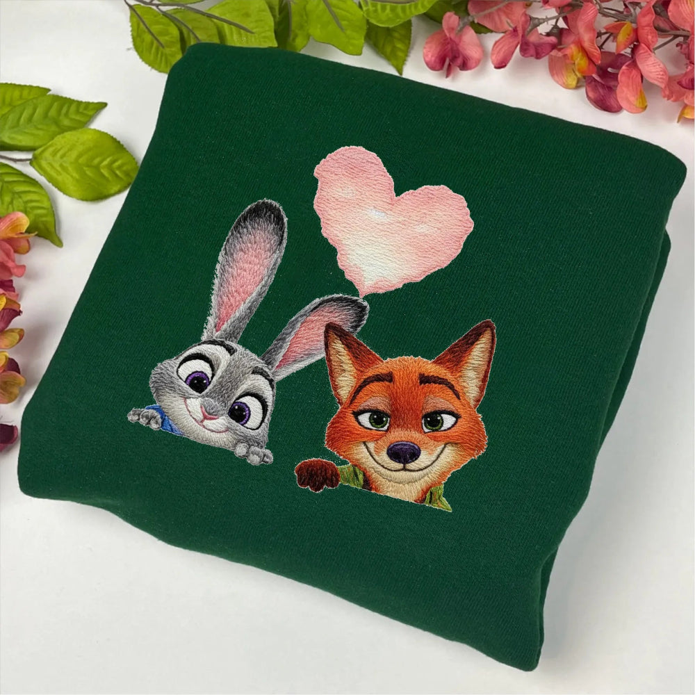 Green Folded Sweatshirt Displaying Embroidered Vintage Zootopia Judy And Nick 